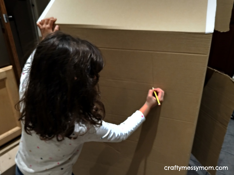 Christmas crafts - making a giant cardboard gingerbread house at craftymessymom.com